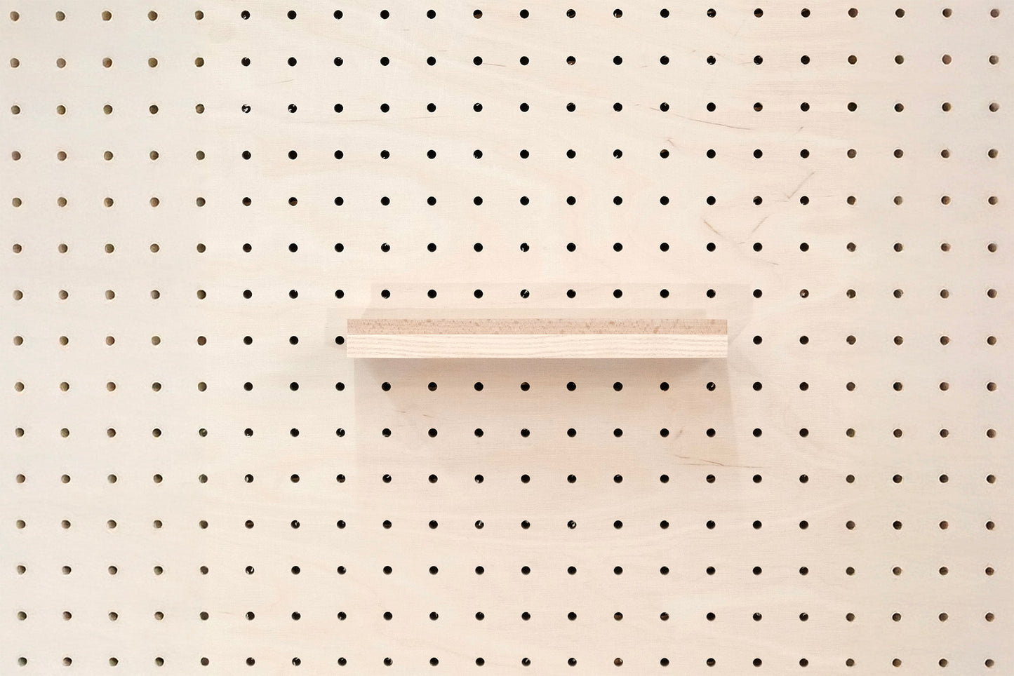 Wooden chair rail for Pegboard and book display