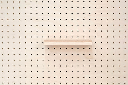 Wooden chair rail for Pegboard and book display