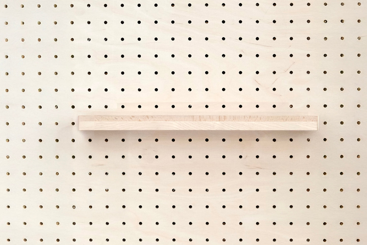 Wooden chair rail for Pegboard and book display